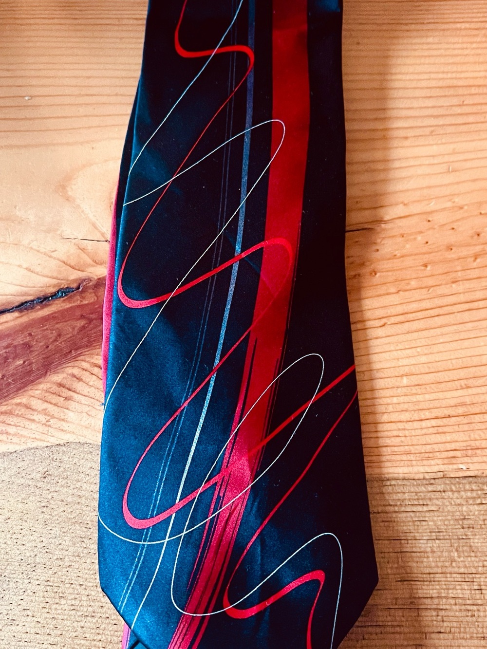 J. Garcia Black Tie with Red and Silver Swirl Design